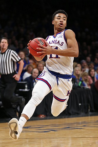 Kansas guard Devon Dotson drives to the basket against Tennessee during the first half of an NCAA college basketball game in the NIT Season Tip-Off tournament Friday, Nov. 23, 2018, in New York. (AP Photo/Adam Hunger)