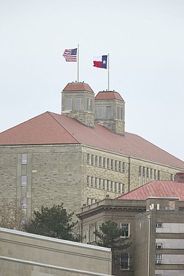 The state flag of Texas temporarily replaced the state flag of Kansas for a brief period over Fraser Hall on Friday, Nov. 23, 2018 at Memorial Stadium.