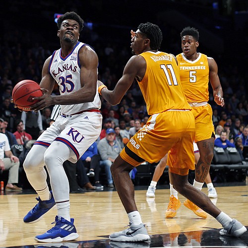 Kansas center Udoka Azubuike (35) looks to the basket as Tennessee forward Kyle Alexander (11) defends during the first half of an NCAA college basketball game in the NIT Season Tip-Off tournament Friday, Nov. 23, 2018, in New York. Kansas won 87-81 in overtime. (AP Photo/Adam Hunger)