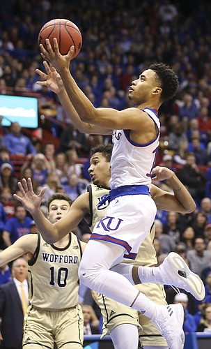 Kansas guard Devon Dotson (11) floats in for a bucket during the first half against Wofford on Tuesday, Dec. 4, 2018 at Allen Fieldhouse.