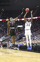 Kansas guard Lagerald Vick (24) puts up a three over New Mexico State guard Terrell Brown (3) during the second half on Saturday, Dec. 8, 2018 at Sprint Center.