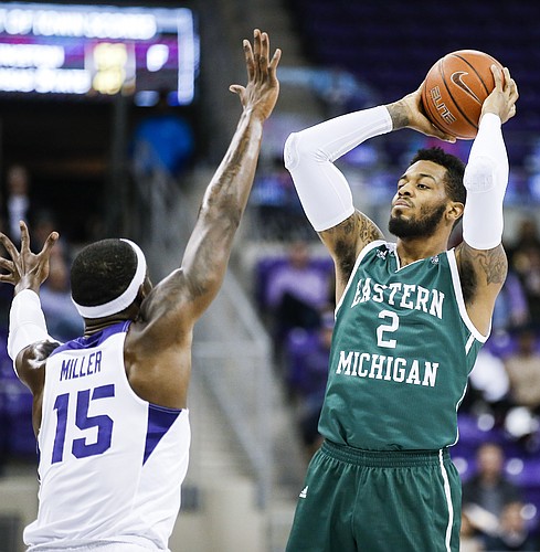 Eastern Michigan forward James Thompson IV (2) looks for room against TCU forward JD Miller (15) during the first half of an NCAA college basketball game, Monday, Nov. 26, 2018, in Fort Worth, Texas. TCU won 87-69. (AP Photo/Brandon Wade)