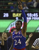 Kansas guard Lagerald Vick (24) reacts after scoring a three-point shot against Baylor in the second half of an NCAA college basketball game, Saturday, Jan. 12, 2019, in Waco, Texas. (AP Photo/Jerry Larson)