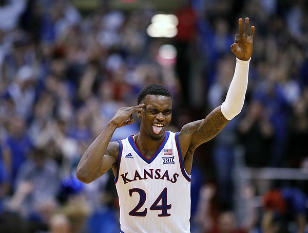 Kansas guard Lagerald Vick (24) celebrates after making a shot during the second half of an NCAA college basketball game against Texas Monday, Jan. 14, 2019, in Lawrence, Kan. Kansas won 80-78. (AP Photo/Charlie Riedel)