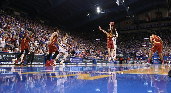 Kansas forward Dedric Lawson (1) pulls up for a three over Iowa State forward Michael Jacobson (12) late in the second half, Monday, Jan. 21, 2019 at Allen Fieldhouse.
