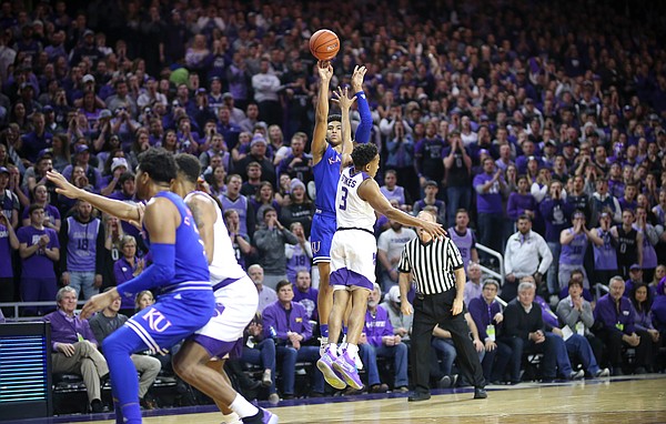 Kansas guard Quentin Grimes (5) puts up a three over Kansas State guard Kamau Stokes (3) during the first half, Tuesday, Feb. 5, 2019 at Bramlage Coliseum.
