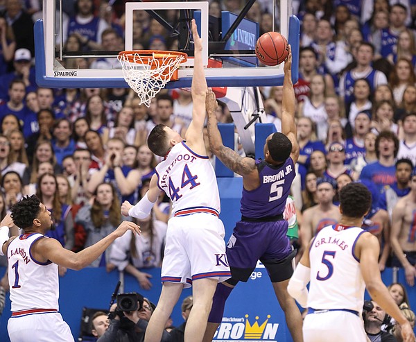 Kansas forward Mitch Lightfoot (44) gets up to block a shot from Kansas State guard Barry Brown Jr. (5) during the first half, Monday, Feb. 25, 2019 at Allen Fieldhouse.