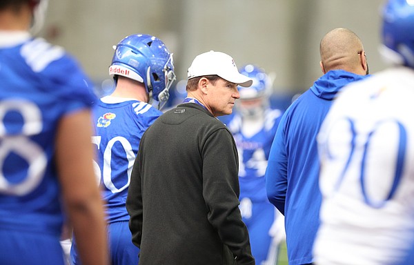 Kansas head coach Les Miles surveys his team during football practice on Wednesday, March 6, 2019 within the new indoor practice facility.