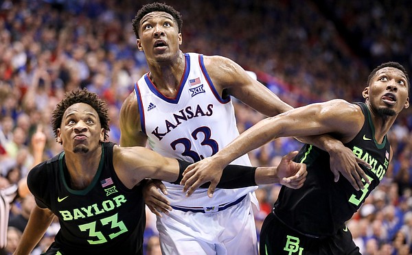 Kansas forward David McCormack (33) muscles for position with Baylor forward Freddie Gillespie (33) and Baylor guard King McClure (3) during the second half, Saturday, March 9, 2019 at Allen Fieldhouse.