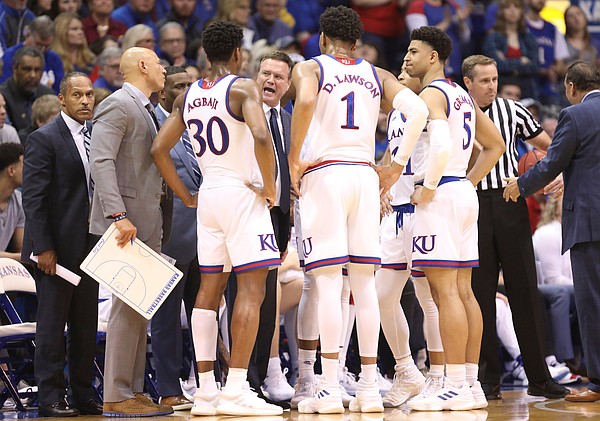 Kansas head coach Bill Self talks with the Jayhawks during a timeout in the first half, Saturday, March 9, 2019 at Allen Fieldhouse.