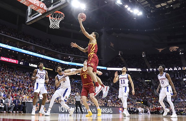 Iowa State guard Nick Weiler-Babb (1) gets in for a bucket as the Jayhawks watch during the second half, Saturday, March 16, 2019 at Sprint Center in Kansas City, Mo.
