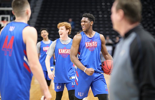 Kansas forward Silvio De Sousa and Kansas guard Chris Teahan (12) celebrate a dunk by a teammate as practice wraps up on Wednesday, March 20, 2019 at Vivint Smart Home Arena in Salt Lake City, Utah. Teams practiced and gave interviews to media members before Thursday's opening round games.