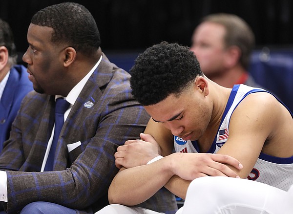 Kansas guard Devon Dotson (11) hangs his head on the bench after fouling out during the second half on Saturday, March 23, 2019 at Vivint Smart Homes Arena in Salt Lake City, Utah.