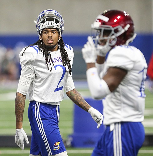 Kansas cornerback Corione Harris watches a drill from the sideline on Thursday, April 4, 2019 at the indoor practice facility.