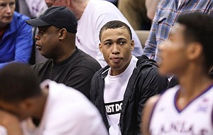 Kansas 2020 recruit R.J. Hampton watches from behind the bench during the second half, Saturday, March 9, 2019 at Allen Fieldhouse.