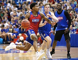 Kansas guard Ochai Agbaji (30) goes hard to the bucket against KU walk-on Michael Jankovic during a scrimmage on Tuesday, June 11, 2019 at Allen Fieldhouse.