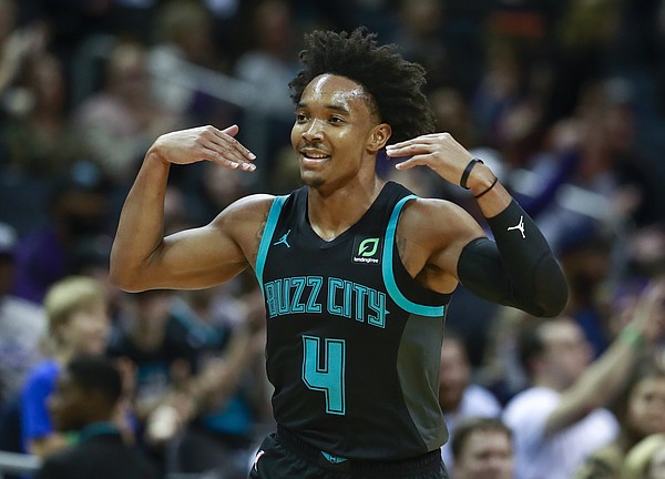 Charlotte Hornets guard Devonte Graham gestures after making a 3-point basket during the second half of an NBA basketball game against the Orlando Magic on Monday, Dec. 31, 2018, in Charlotte, N.C. The Hornets won 125-100. (AP Photo/Jason E. Miczek)
