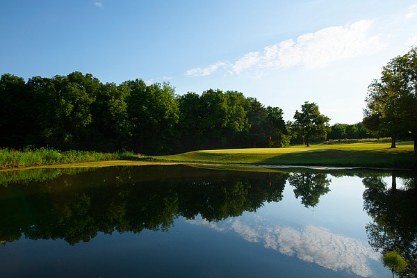 The number 9 hole at Hidden Springs Golf Course in Overbrook, Kan. The green on the ninth hole sits just beyond a pond off to the right of the fairway.