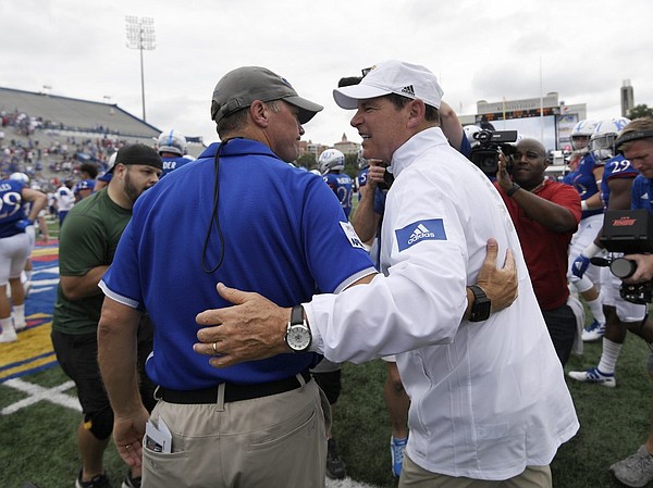 Kansas head coach Les Miles met with Indiana State head coach Curt Mallory after the game Saturday afternoon at David Booth Kansas Memorial Stadium on Aug. 31, 2019.