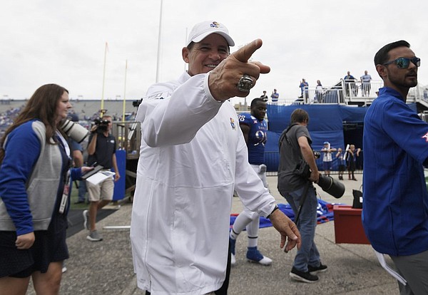 Kansas head coach Les Miles points to a fan as he walks off the field Saturday afternoon at David Booth Kansas Memorial Stadium on Aug. 31, 2019.