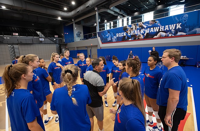 Kansas volleyball head coach Ray Bechard talks with his team before practice at the new Horejsi Family Volleyball Arena on Wednesday, Sept. 11, 2019.