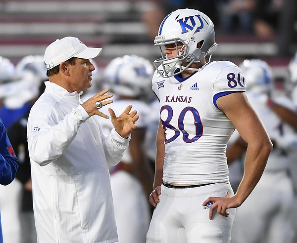 (Boston, MA, 09/13/19) Kansas Jayhawks head coach Les Miles, left, talks with punter Kyle Thompson (80) prior to the start of an NCAA football game at Boston College in Boston, Mass., on Friday, September 13, 2019.