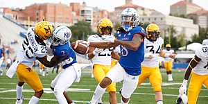 Kansas wide receiver Kwamie Lassiter II (8) heads for the end zone for a touchdown during the second quarter on Saturday, Sept. 21, 2019 at David Booth Kansas Memorial Stadium.