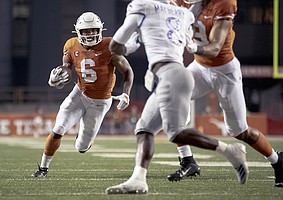 Texas wide receiver Devin Duvernay (6) runs for a touchdown against Kansas during an NCAA college football game Saturday, Oct. 19, 2019, in Austin, Texas. (Nick Wagner/Austin American-Statesman via AP)