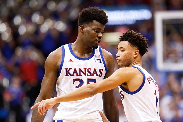 Kansas center Udoka Azubuike (35) and Kansas guard Devon Dotson (1) have a quick meeting on the court after a timeout during the second half, Friday, Nov. 8, 2019 at Allen Fieldhouse.