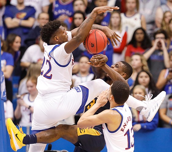Kansas forward Silvio De Sousa (22) engulfs a shot attempt by East Tennessee State guard Bo Hodges (3) during the second half on Tuesday, Nov. 19, 2019 at Allen Fieldhouse.