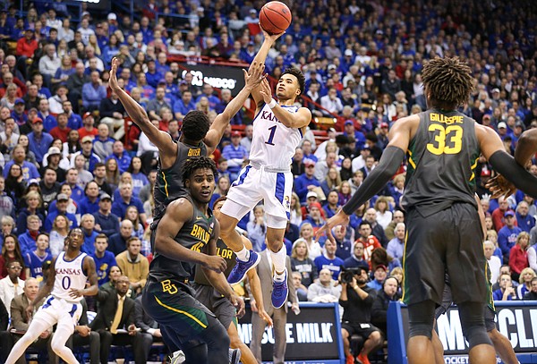 Kansas Jayhawks guard Devon Dotson (1) puts a floater over Baylor Bears guard Jared Butler (12) during the first half on Saturday, Jan. 11, 2020 at Allen Fieldhouse.