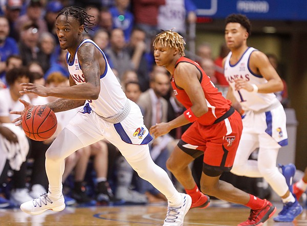 Kansas guard Marcus Garrett (0) comes away with a steal during the first half, Saturday, Feb. 1, 2020 at Allen Fieldhouse.