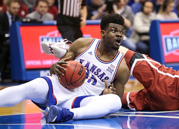 Kansas center Udoka Azubuike (35) comes away with a ball on the floor during the first half on Saturday, Feb. 15, 2020 at Allen Fieldhouse.