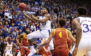 Kansas guard Ochai Agbaji (30) coasts to the bucket between the Iowa State defense during the first half on Monday, Feb. 17, 2020 at Allen Fieldhouse.