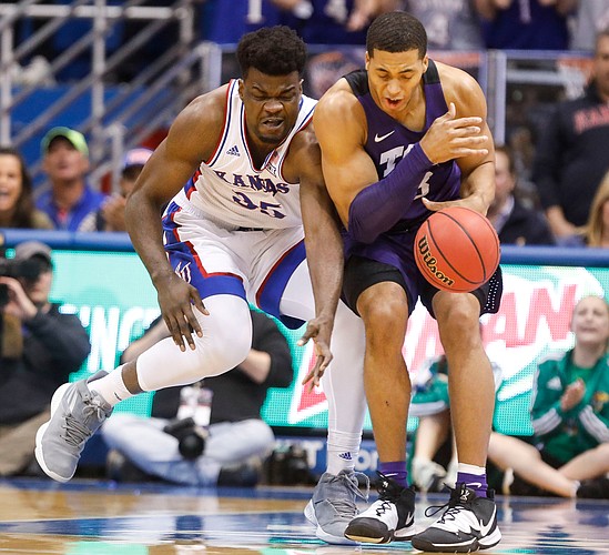 Kansas center Udoka Azubuike (35) collides with TCU forward Jaedon LeDee (23) while competing for a ball during the first half, Wednesday, March 5, 2020 at Allen Fieldhouse.