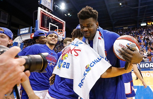 Kansas center Udoka Azubuike (35) gets hugs from his teammates after his Senior Night speech, Wednesday, March 5, 2020 at Allen Fieldhouse.