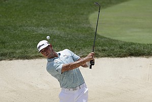 Gary Woodland hits from a bunker toward the first green during the third round of the Memorial golf tournament, Saturday, July 18, 2020, in Dublin, Ohio.


