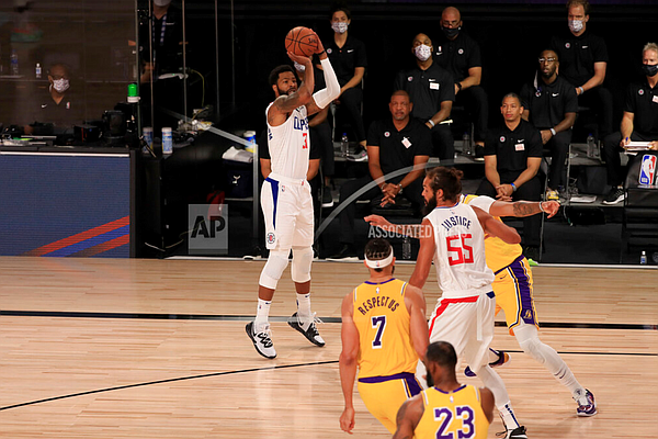 Los Angeles Clippers' Marcus Morris Sr. (31) shoots against the Los Angeles Lakers during the first quarter of an NBA basketball game Thursday, July 30, 2020, in Lake Buena Vista, Fla. (Mike Ehrmann/Pool Photo via AP)
