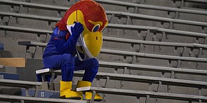 Kansas Jayhawk mascot sits in the empty stands during the second half of an NCAA college football game against Coastal Carolina in Lawrence, Kan., Saturday, Sept. 12, 2020. Coastal Carolina defeated Kansas 38-23. (AP Photo/Orlin Wagner)