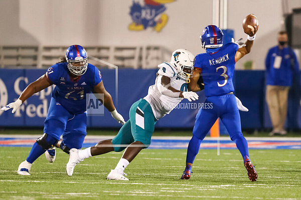 Coastal Carolina defensive end Tarron Jackson (9) puts a big hit on Kansas quarterback Miles Kendrick (3) in the fourth quarter of a college football game between the Chanticleers and Jayhawks on September 12, 2020 at Memorial Stadium. (Photo by Scott Winters/Icon Sportswire via AP Images)