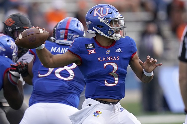 Kansas quarterback Miles Kendrick passes to a teammate during the first half of an NCAA college football game against Oklahoma State in Lawrence, Kan., Saturday, Oct. 3, 2020.


