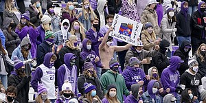 Kansas State fans celebrate during the second half of an NCAA college football game against Kansas Saturday, Oct. 24, 2020, in Manhattan, Kan. (AP Photo/Charlie Riedel)