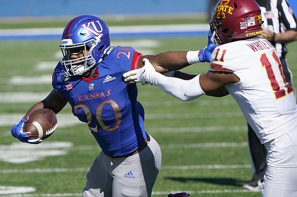 Kansas running back Daniel Hishaw Jr. (20) gets past Iowa State defensive back Lawrence White IV (11) for a touchdown during the first half of an NCAA college football game in Lawrence, Kan., Saturday, Oct. 31, 2020. (AP Photo/Orlin Wagner)