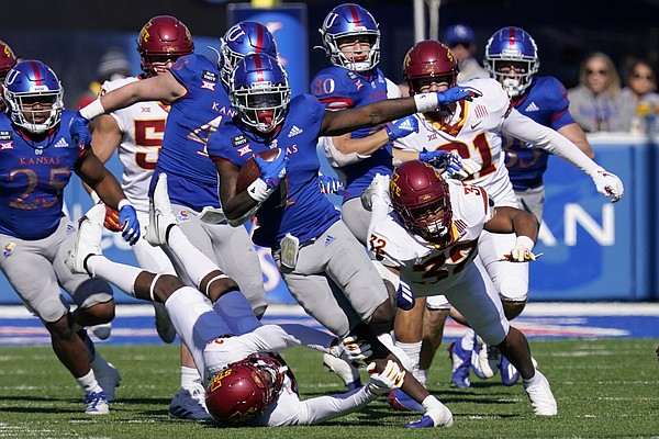 Kansas return specialist Kenny Logan Jr. (1) breaks away from Iowa State defenders Gerry Vaughn (32) and Vonzell Kelley III (29) for a 100-yard touchdown kickoff return during the second half of an NCAA college football game in Lawrence, Kan., Saturday, Oct. 31, 2020. (AP Photo/Orlin Wagner)

