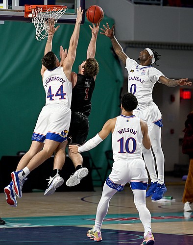 Kansas players Marcus Garrett and Mitch Lightfoot defend a shot during a game against Saint Joseph's on Friday Nov. 27, 2020. The Jayhawks earned a 94-72 win over the Hawks in the Rocket Mortgage Fort Myers Tip-Off at the Suncoast Credit Union Arena in Fort Myers, Florida.