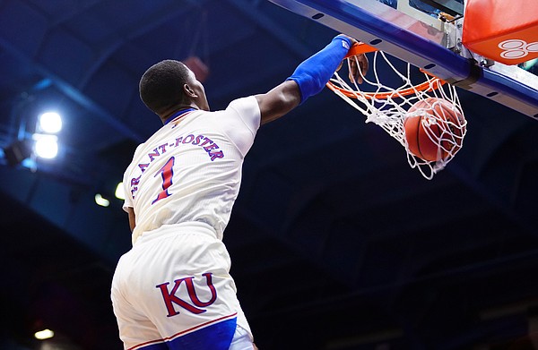Kansas guard Tyon Grant-Foster (1) throws down a dunk during the second half on Friday, Dec. 11, 2020 at Allen Fieldhouse.