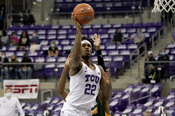 TCU guard RJ Nembhard (22) shoots after getting past North Dakota State guard Maleeck Harden-Hayes, rear, during the second half of an NCAA college basketball game in Fort Worth, Texas, Tuesday, Dec. 22, 2020. (AP Photo/Tony Gutierrez)