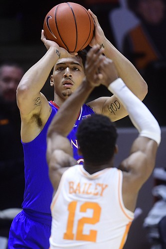 Kansas forward Jalen Wilson (10) is defended against by Tennessee guard Victor Bailey Jr (12) while taking a shot during a basketball game between the Tennessee Volunteers and the Kansas Jayhawks at Thompson-Boling Arena in Knoxville, Tennessee on Saturday, January 30, 2021.