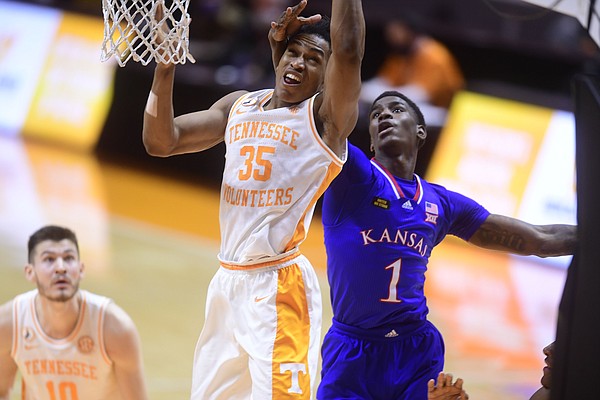 Tennessee guard/forward Yves Pons (35) and Kansas guard Tyon Grant-Foster (1) go for the rebound ball during a basketball game between the Tennessee Volunteers and the Kansas Jayhawks at Thompson-Boling Arena in Knoxville, Tennessee on Saturday, January 30, 2021.
