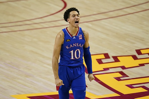 Kansas forward Jalen Wilson celebrates after making a 3-point basket during the second half of an NCAA college basketball game against Iowa State, Saturday, Feb. 13, 2021, in Ames, Iowa. Kansas won 64-50. (AP Photo/Charlie Neibergall)
